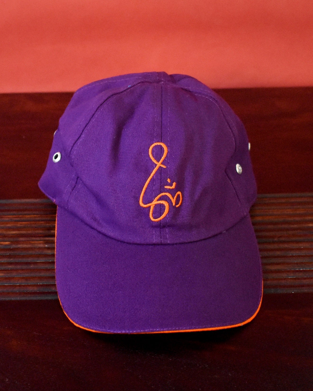 Purple cap with orange om embroidery