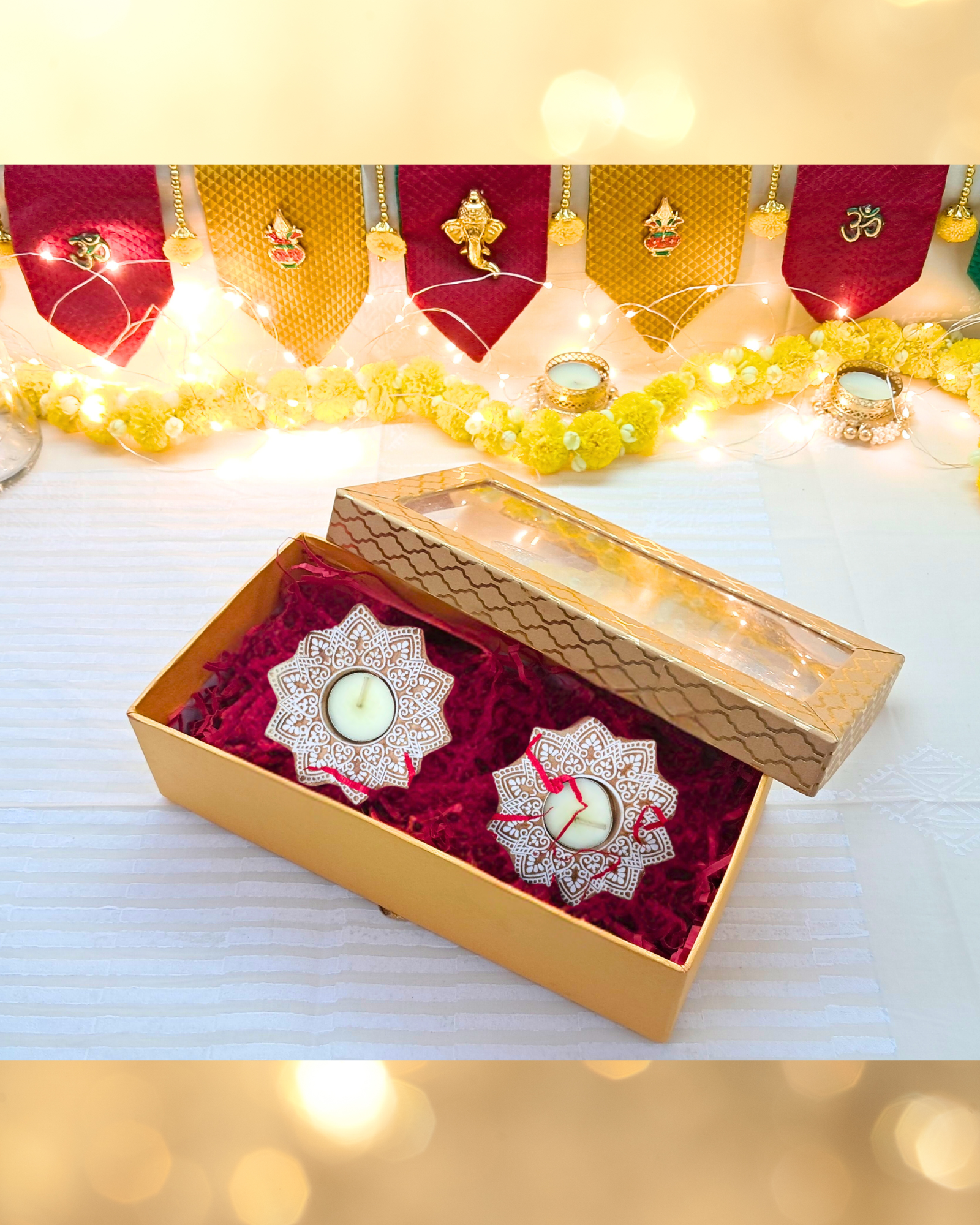 wood block tealight holder with candle in a gold box with festive lights
